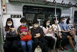 Passengers wear masks to prevent contracting Middle East Respiratory Syndrome (MERS)
