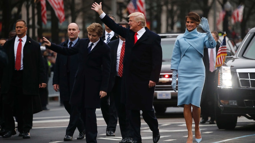Donald Trump and first lady Melania Trump walk along Pennsylvania Avenue during the inaugural parade