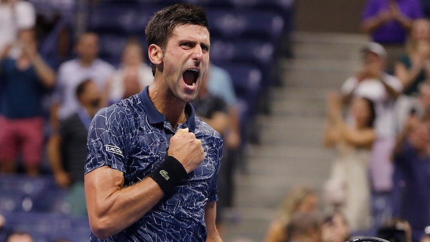 Novak Djokovic shouts and clenches a fist against his chest, as he celebrates his win