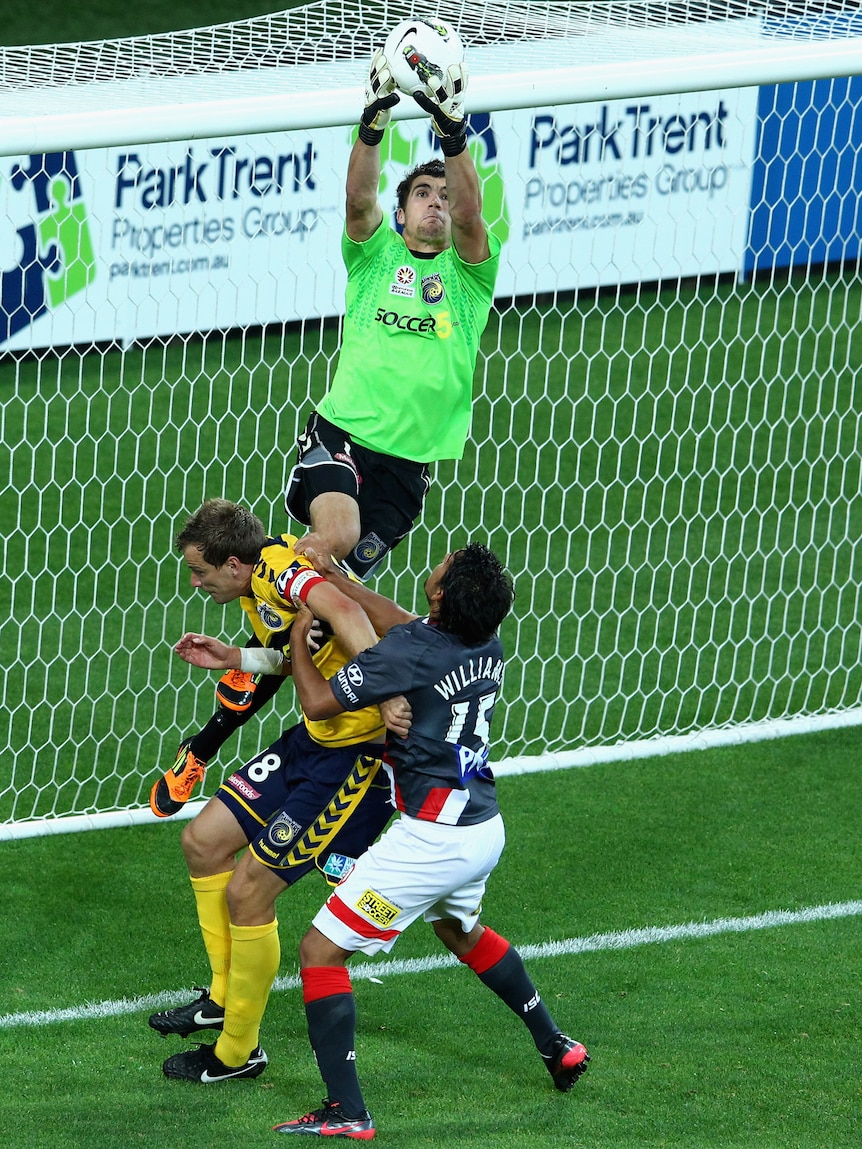 Mariners goalkeeper Matthew Ryan leaps high for a ball against the Melbourne Heart.