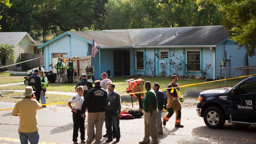 Police cordon around the Florida home partly consumed by sinkhole