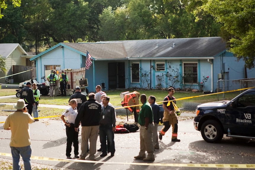 Police cordon around the Florida home partly consumed by sinkhole