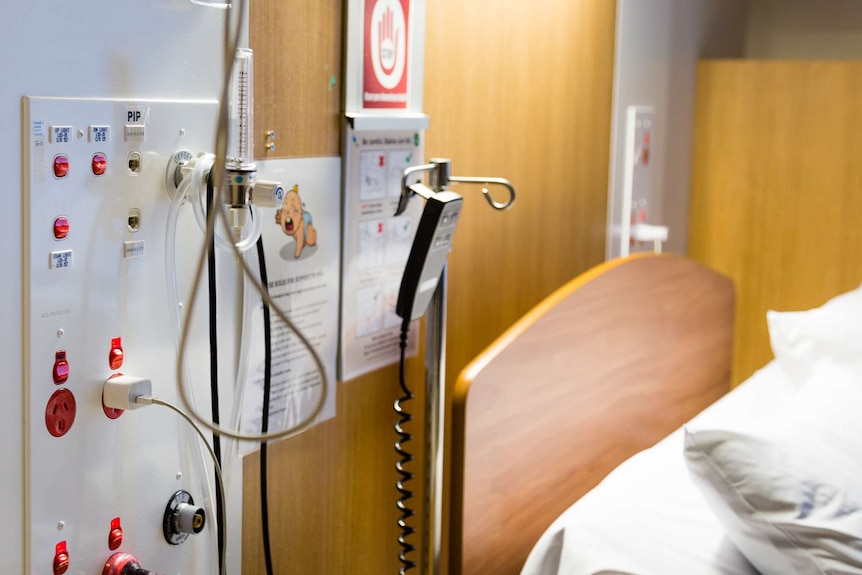 A close up of a hospital bed in a hospital.