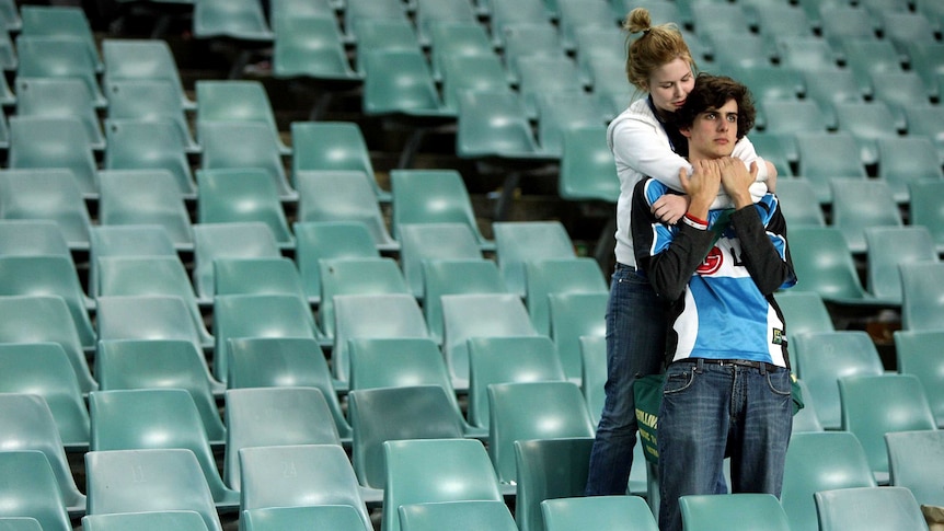 Heartbreak and pain ... Sharks supporters after the club's fourth straight preliminary loss in 2008