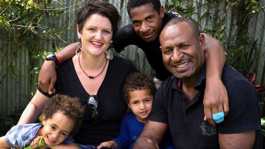 Australian woman Angela Kelly-Hanku with her husband and three children.