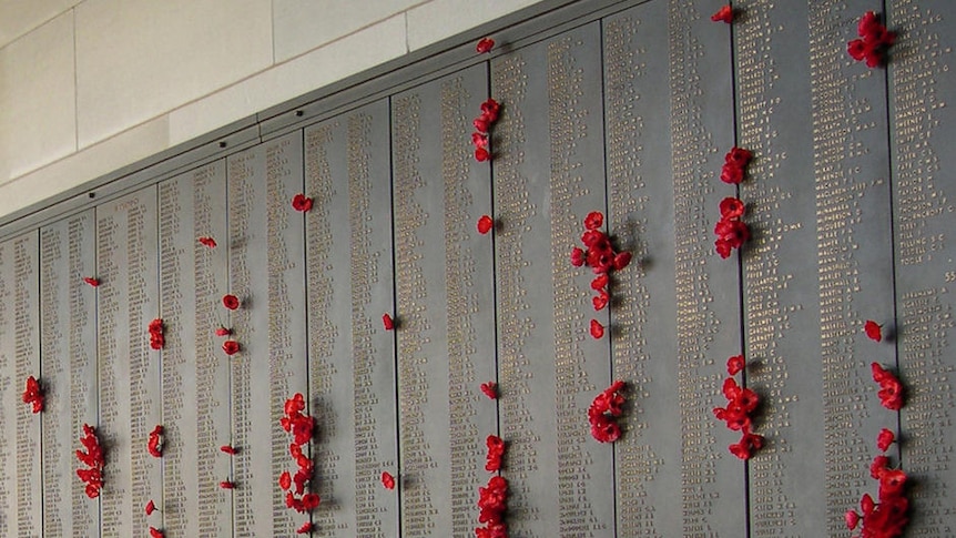 The Roll of Honour with red poppies placed beside names at the Australian War Memorial in Canberra.