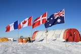 Flags flying over Mount Brown South ice core drill camp, Antarctica.