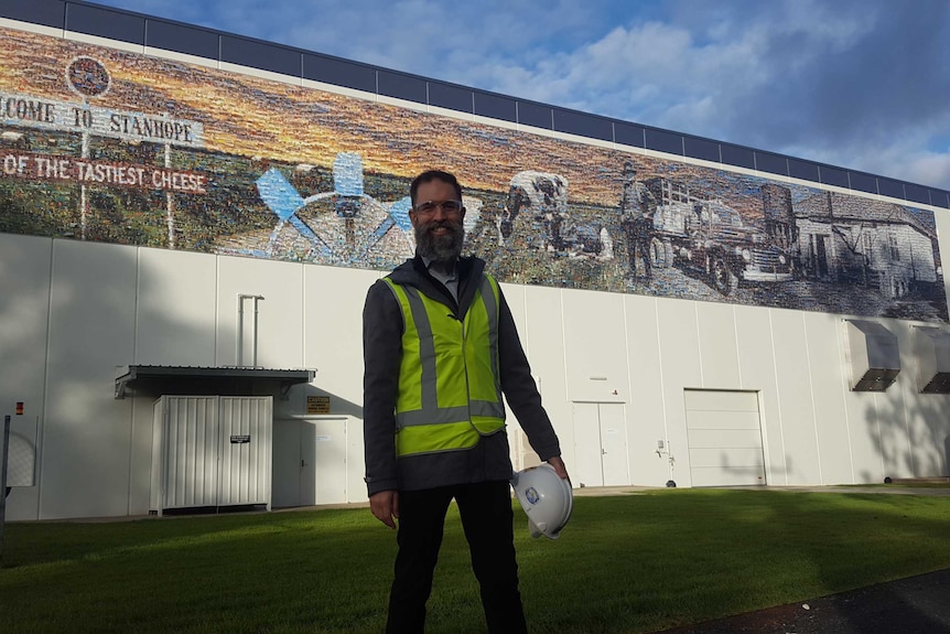 Plant manager Jason Wright stands in front of Fonterra's new cheese plant at Stanhope.