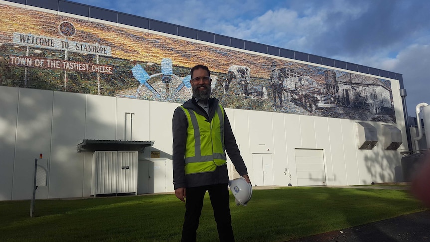 Plant manager Jason Wright stands in front of Fonterra's new cheese plant at Stanhope.