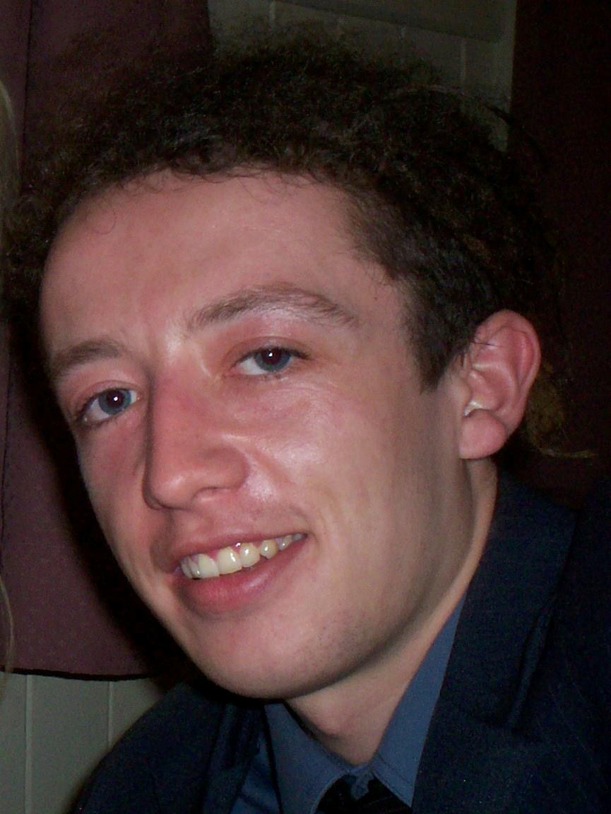 An old photo of a young man.