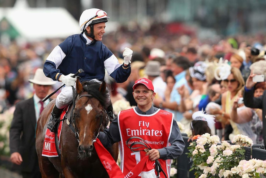 Brett Prebble celebrates winning Melbourne Cup atop Green Moon