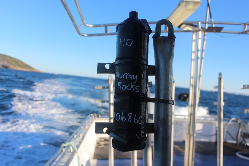 An acoustic receiver has "Murray Rocks" written on it, which is where it will be dropped.