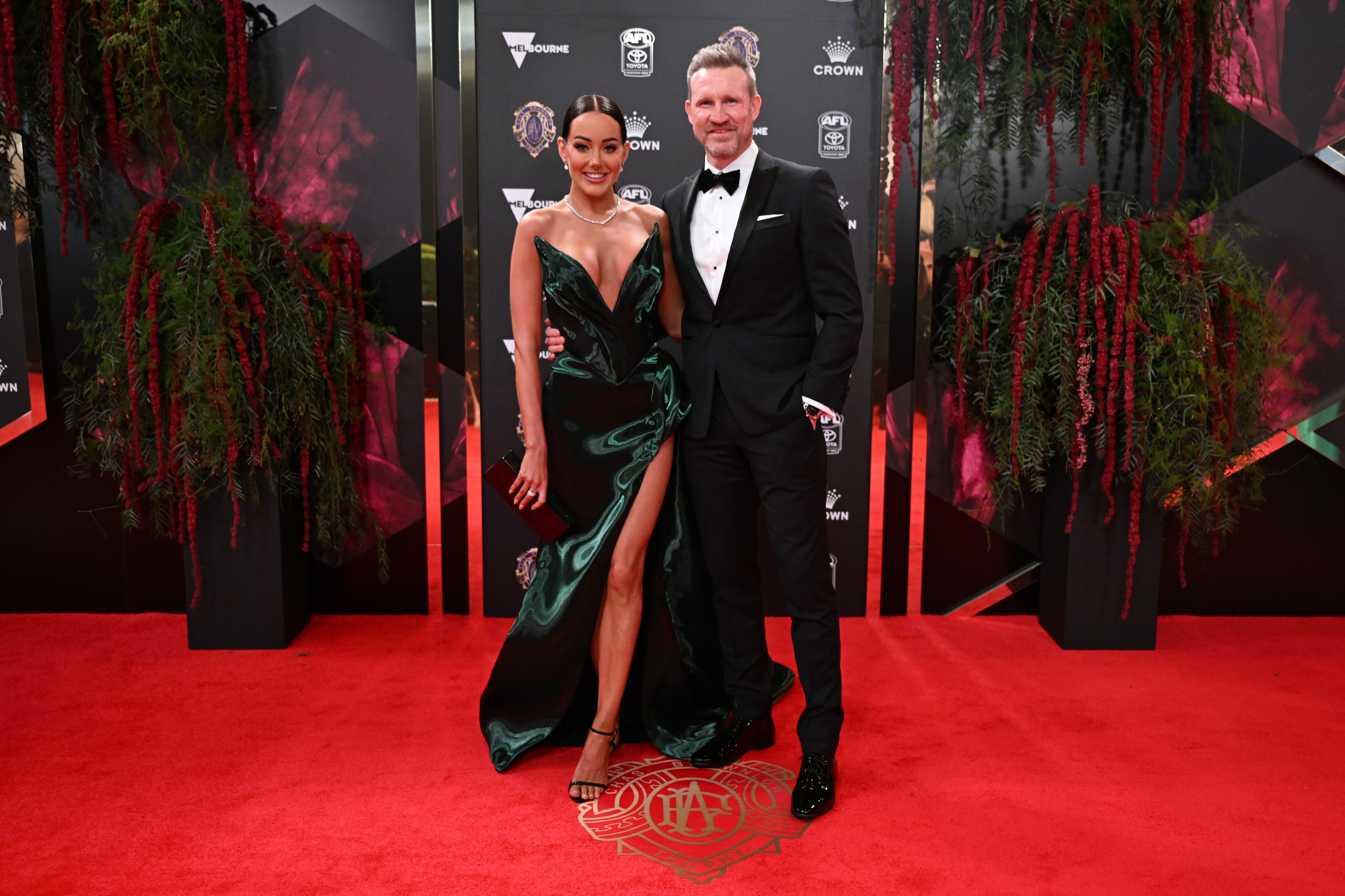 Former Collingwood head coach Nathan Buckley looks dapper next to his girlfriend, Brodie Ryan.