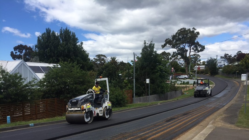 Machinery on the plastic glass composite road in Snug, Tasmania.