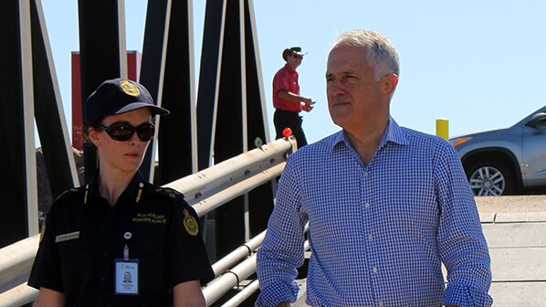 Prime Minister stands on Darwin's East Arm Wharf