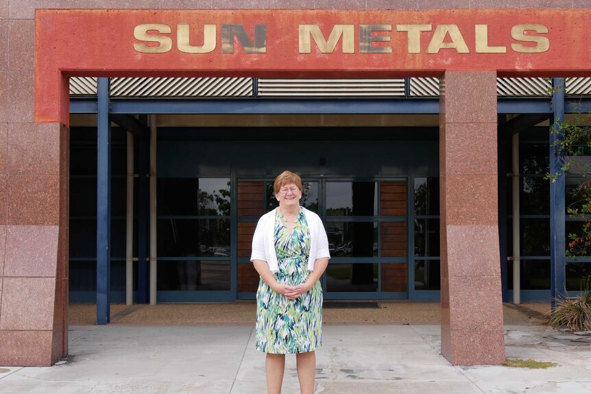 Kathy Danaher smiling in front of the Sun Metals building in Townsville