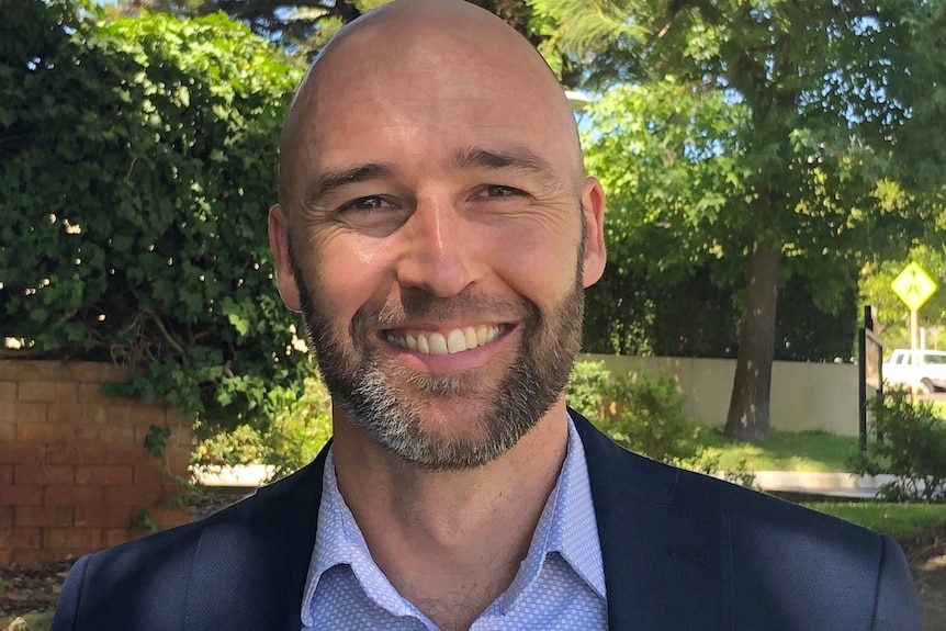 A tight head and shoulders shot of a smiling Brent Thomas, Airbnb's head of public policy.