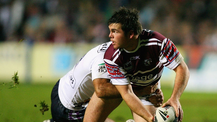Tight win ... Manly five-eighth Jamie Lyon offloads the ball against the Storm