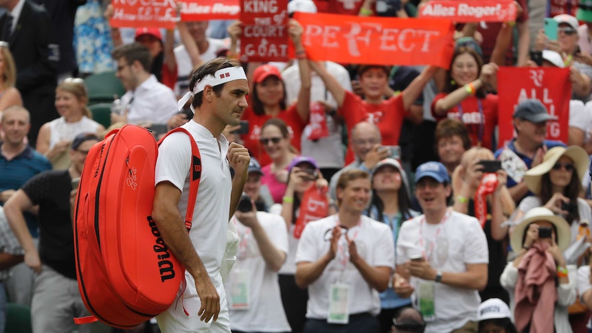 Roger Federer walks on the court prior to his Wimbledon match with Lukas Lacko on July 4, 2018.