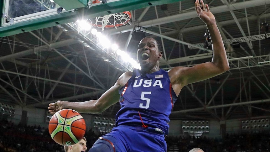 Kevin Durant dunks against Serbia during the men's gold medal basketball game.