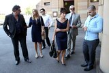 Family members of Nicholas Lambaditis, on trial for the murder of Brazilian Lucio Stein Rodrigues, wait outside court in Sydney.