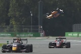 Race car becomes airborne in crash.