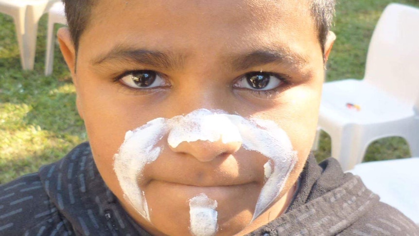 A small child with face paint