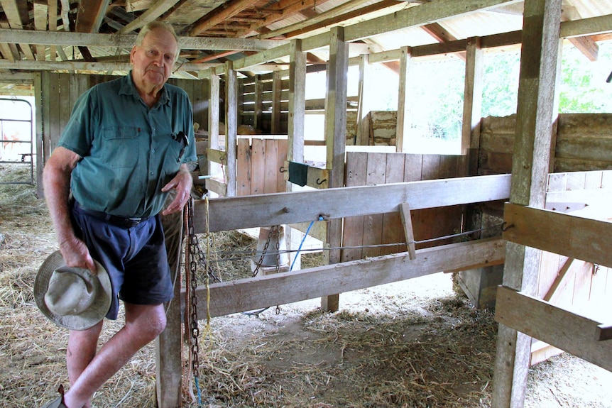 Ivan Stiller stands in his old dairy which hasn't been used in decades