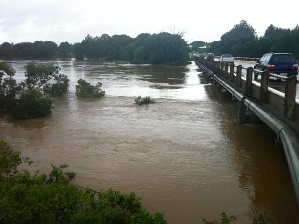 Swollen Mary River flows under the Normanby Bridge at Gympie today.