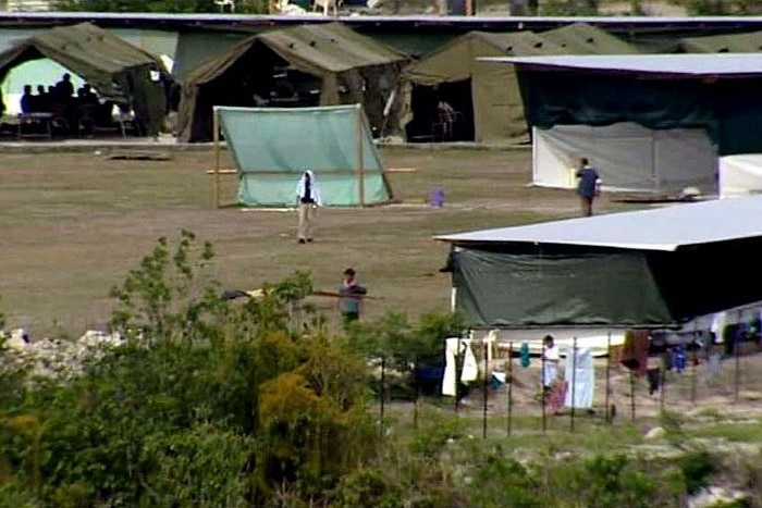 Refugees walk about the detention centre on the island of Nauru, date unknown.