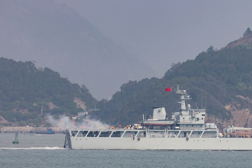 A Chinese warship fires toward the shore during a military drill near Taiwan controlled Matsu Islands