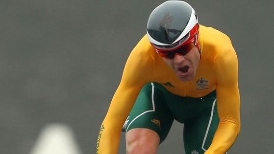 Cadel Evans battles during the time trial