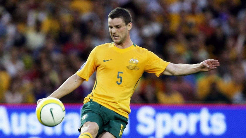 Jason Culina controls the ball