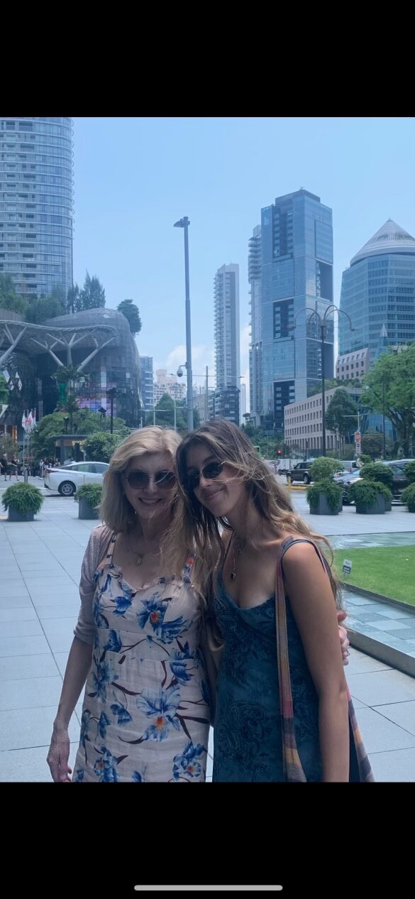 Belinda, wearing sunglasses and a white and blue dress (Left) and Vienna wearing a blue singlet and sunglasses (right).