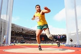 Don Elgin, an Australian athlete with a prosthetic leg, throws a discus during the Glasgow Commonwealth Games.
