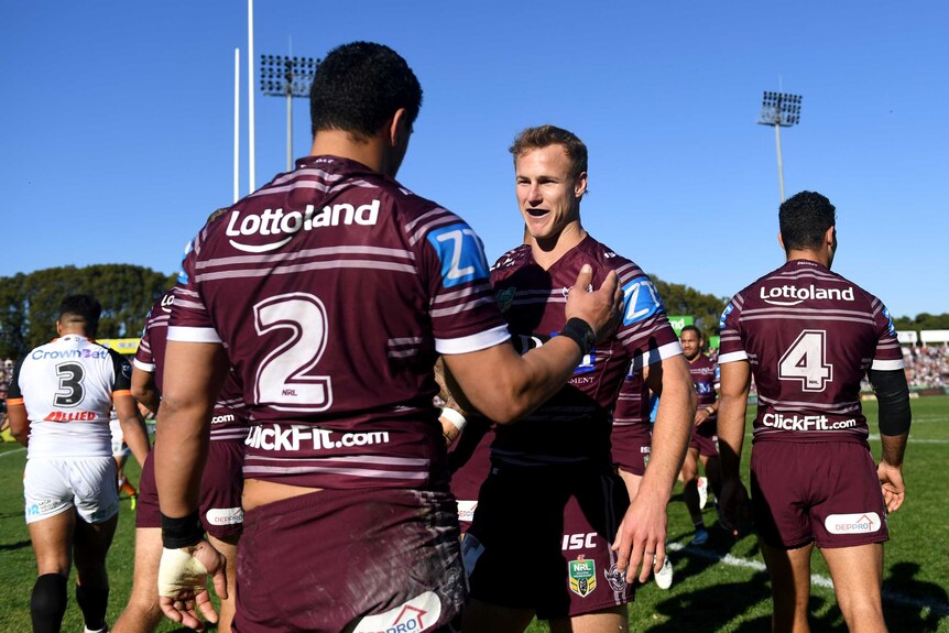 Daly Cherry-Evans and Manly Sea Eagles celebrate a try