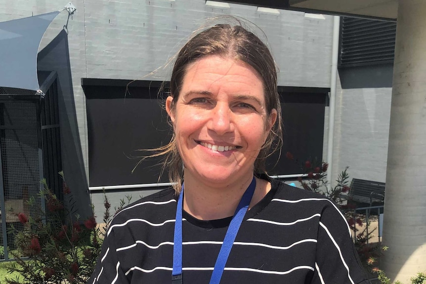 RSPCA chief vet Emma Bronts smiling at the camera standing outside on a sunny day.