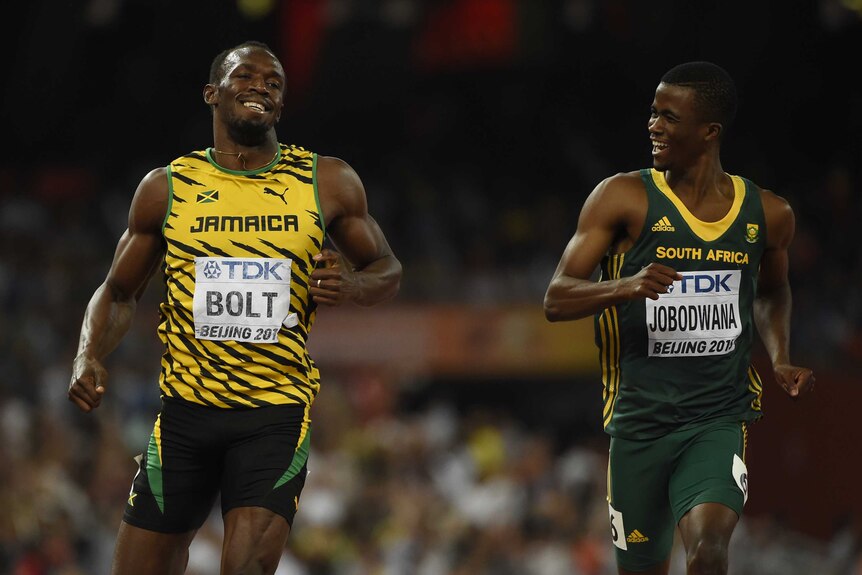 Usain Bolt coasts alongside Anaso Jobodwana