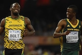 Usain Bolt coasts alongside Anaso Jobodwana