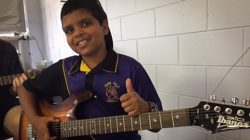 Aboriginal boy with guitar