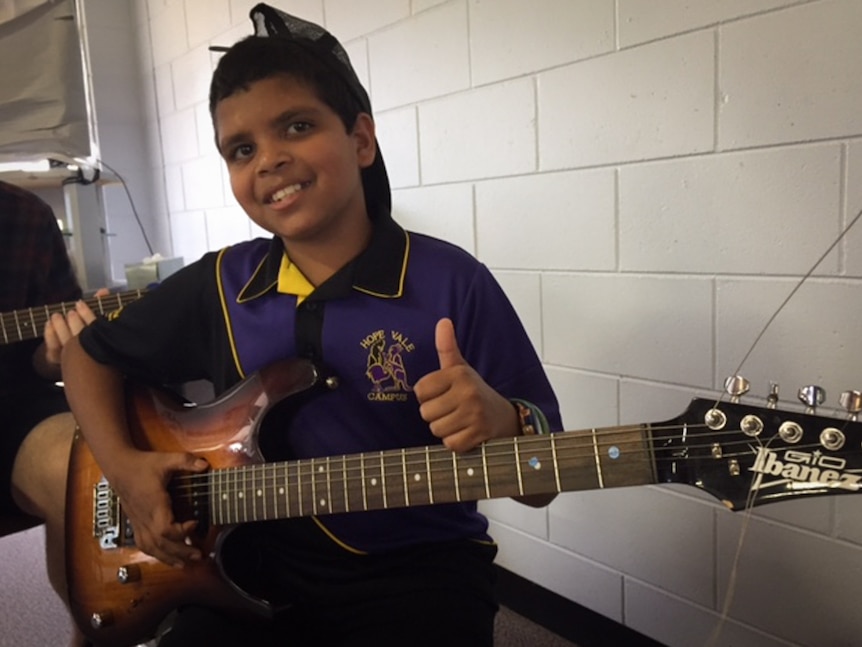 Aboriginal boy with guitar