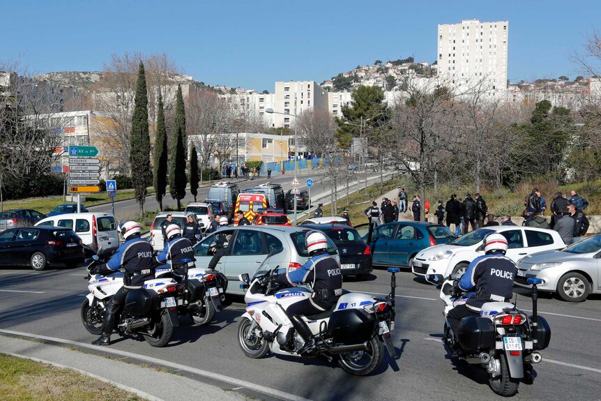 Police officers secure the access to the Castellane estate in Marseille.