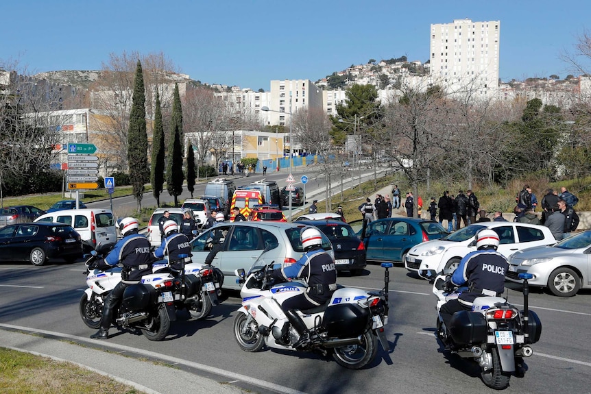 Police officers secure the access to the Castellane estate in Marseille.