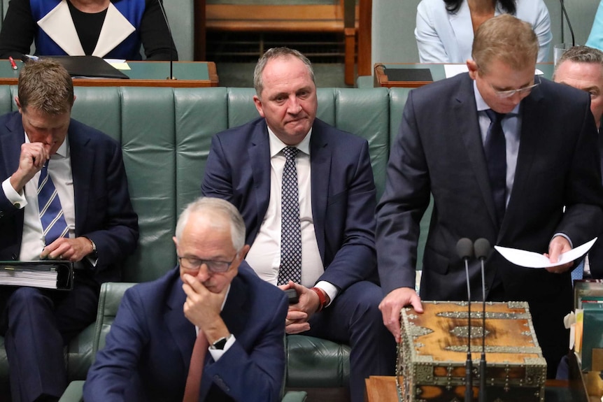 Barnaby Joyce stares into the middle distance and bites his lip in the House of Representatives.