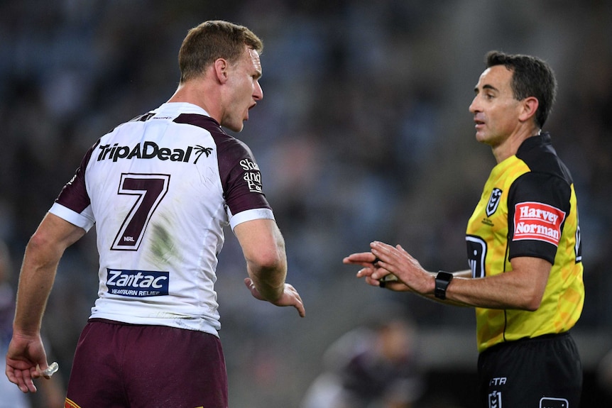 Daly Cherry-Evans talks to a placating referee during an NRL match