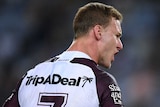Daly Cherry-Evans talks to a placating referee during an NRL match