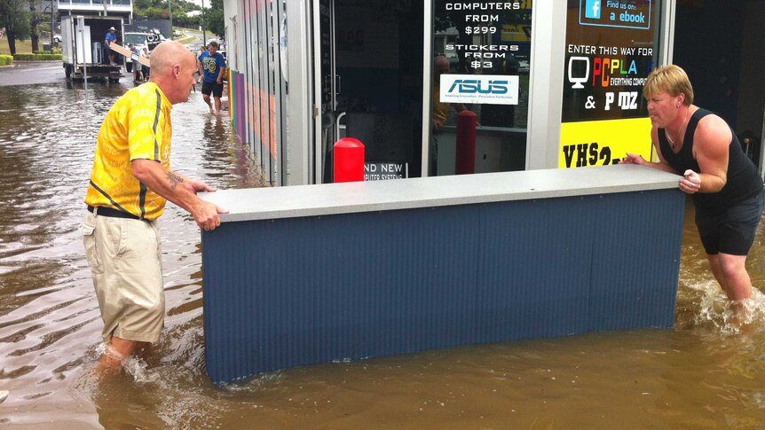 People in Gympie moving stock fittings from local shop