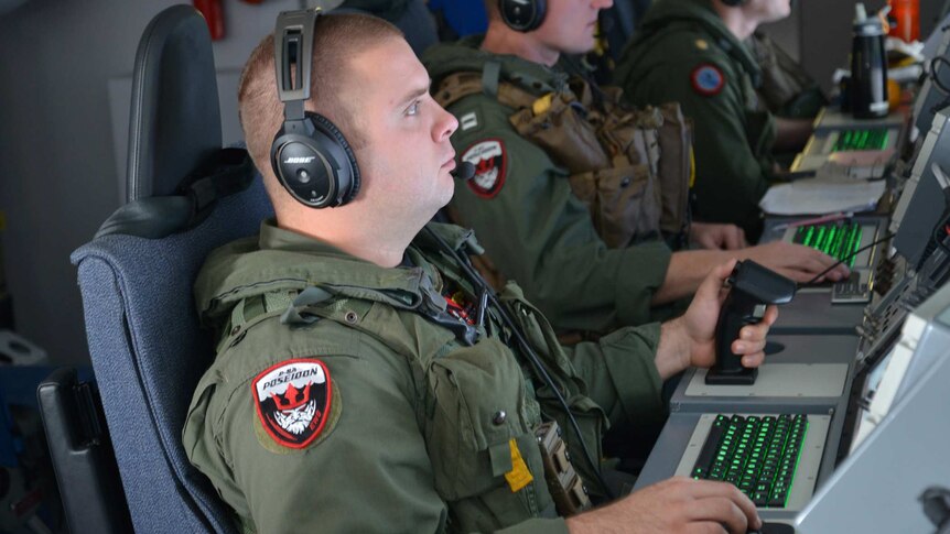 US electronic warfare operator Mike Burnett searches for Malaysia Airlines flight MH370.