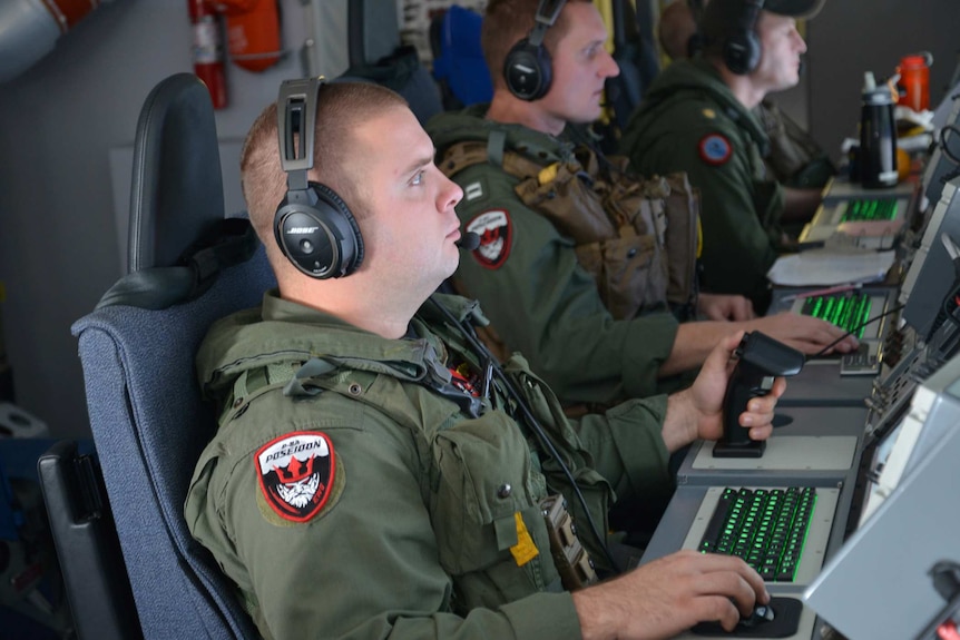 US electronic warfare operator Mike Burnett searches for Malaysia Airlines flight MH370.