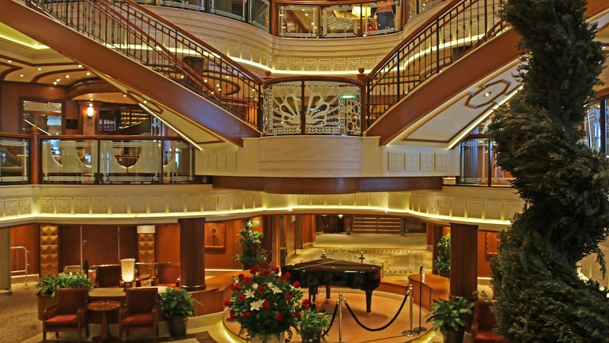 Ornate stairwell and grand piano